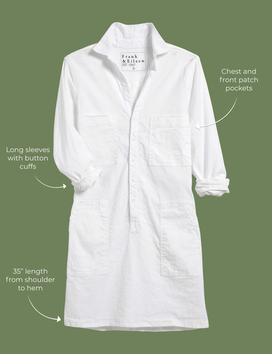 Lay flat image of the Southern Ireland dress. Arrows are pointing to different areas of the dress and text highlights features including chest and front patch pockets, long sleeves with button cuffs, 35" length from shoulder to hem. 